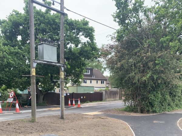 path with pedestrian crossing and bin