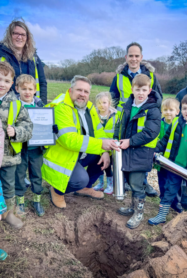 School children with the deputy mayor, teachers and staff in high-vis