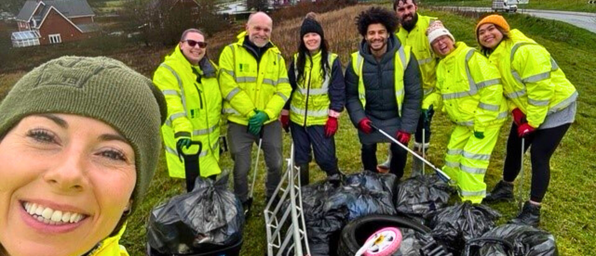 Selfie of OHH and Wates team of litter pickers in high-vis