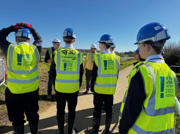 Secondary school students taking a tour on a construction site