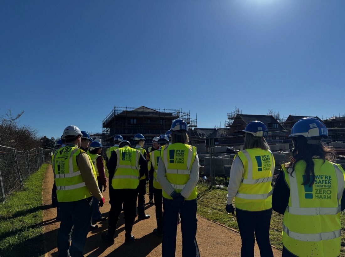 Secondary school students taking a tour on a construction site