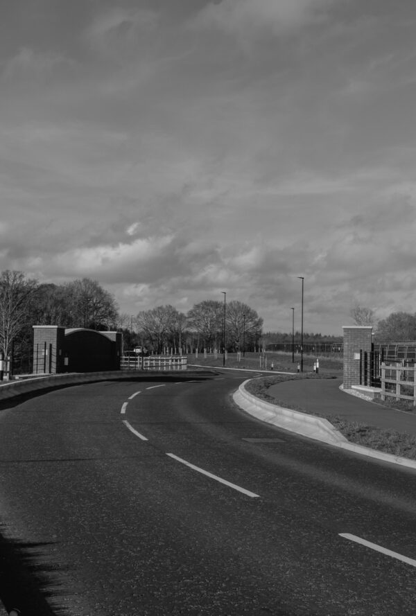 Black and white image of a winding road an bridge at One Horton Heath