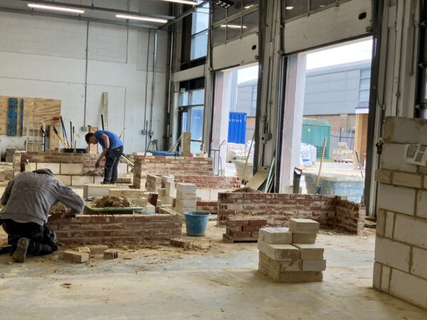 Bricklaying students at Eastleigh College in the workshop